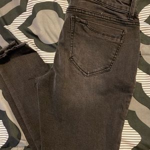 Black stonewashed ripped skinny jeans